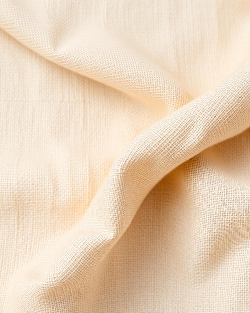 Bolt of European linen resting on the cutting table